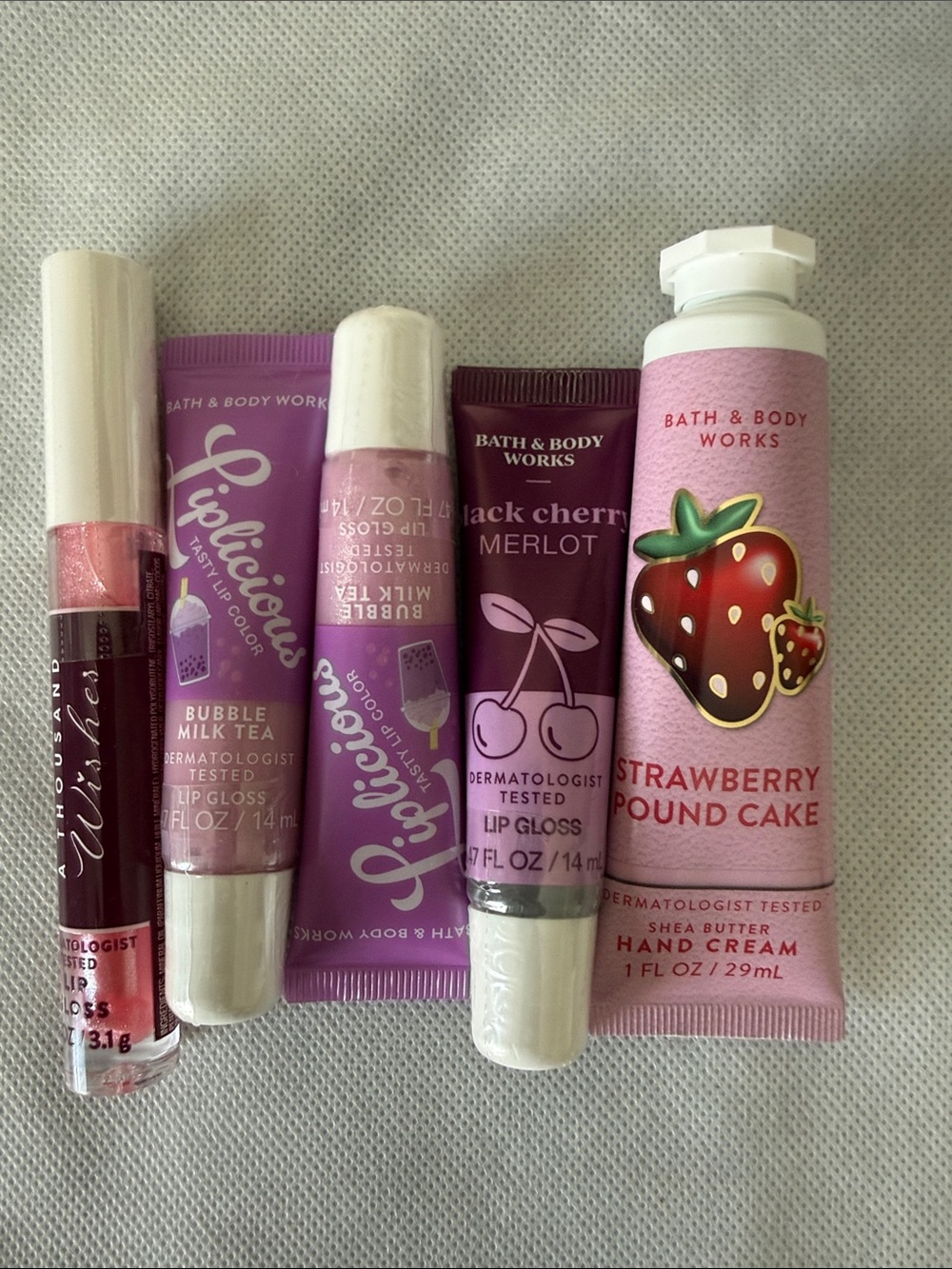 Five Piece Bath & Body Works Travel Sized Lip glosses and hand lotion